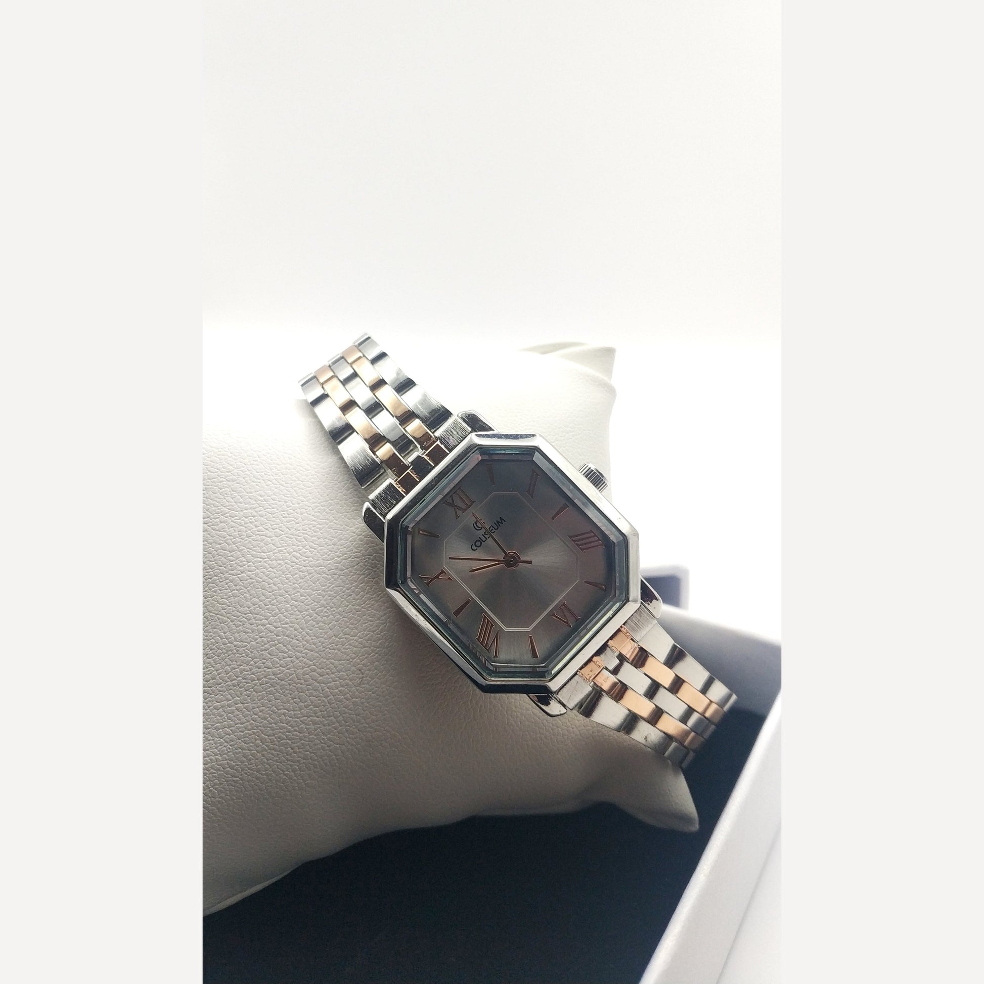 Women’s silver stainless steel watch with octagon dial and rose gold Roman numerals – elegant modern accessory