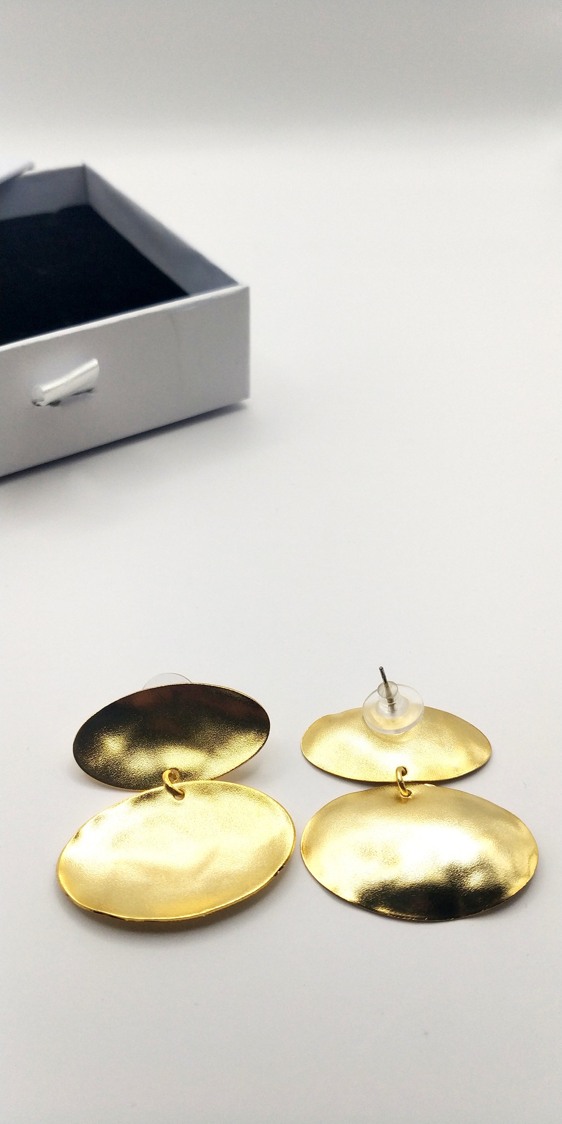 Heliades Earrings – Greek Hammered Jewelry – Available in 18K Gold, Silver, and Rose Gold Plated. Radiant hammered circular discs inspired by the daughters of the Sun.