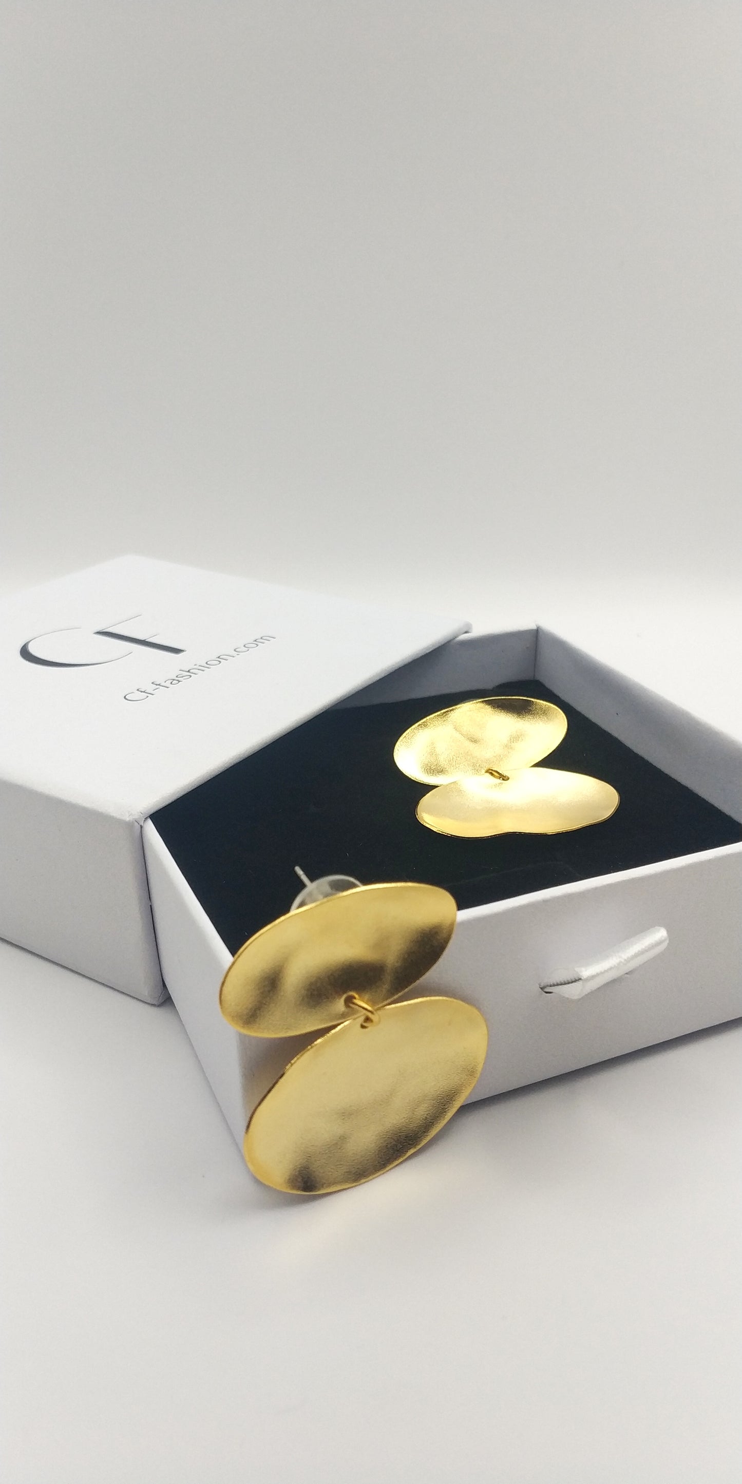 Heliades Earrings – Greek Hammered Jewelry – Available in 18K Gold, Silver, and Rose Gold Plated. Radiant hammered circular discs inspired by the daughters of the Sun.