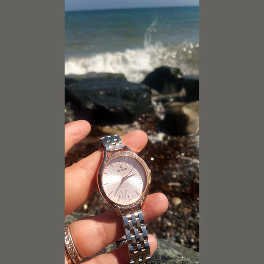 Women’s two-tone stainless steel watch in silver and rose gold with white dial and crystal bezel