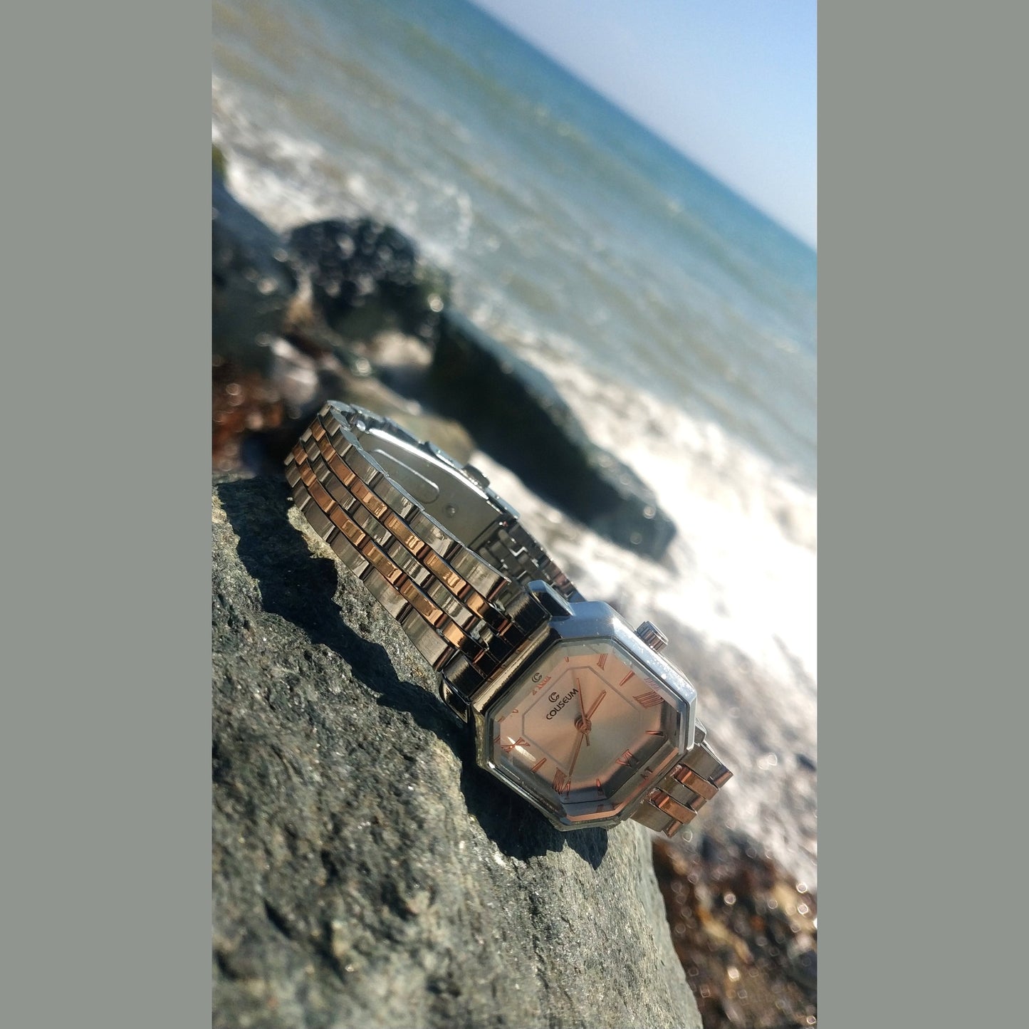 Women’s silver stainless steel watch with octagon dial and rose gold Roman numerals – elegant modern accessory