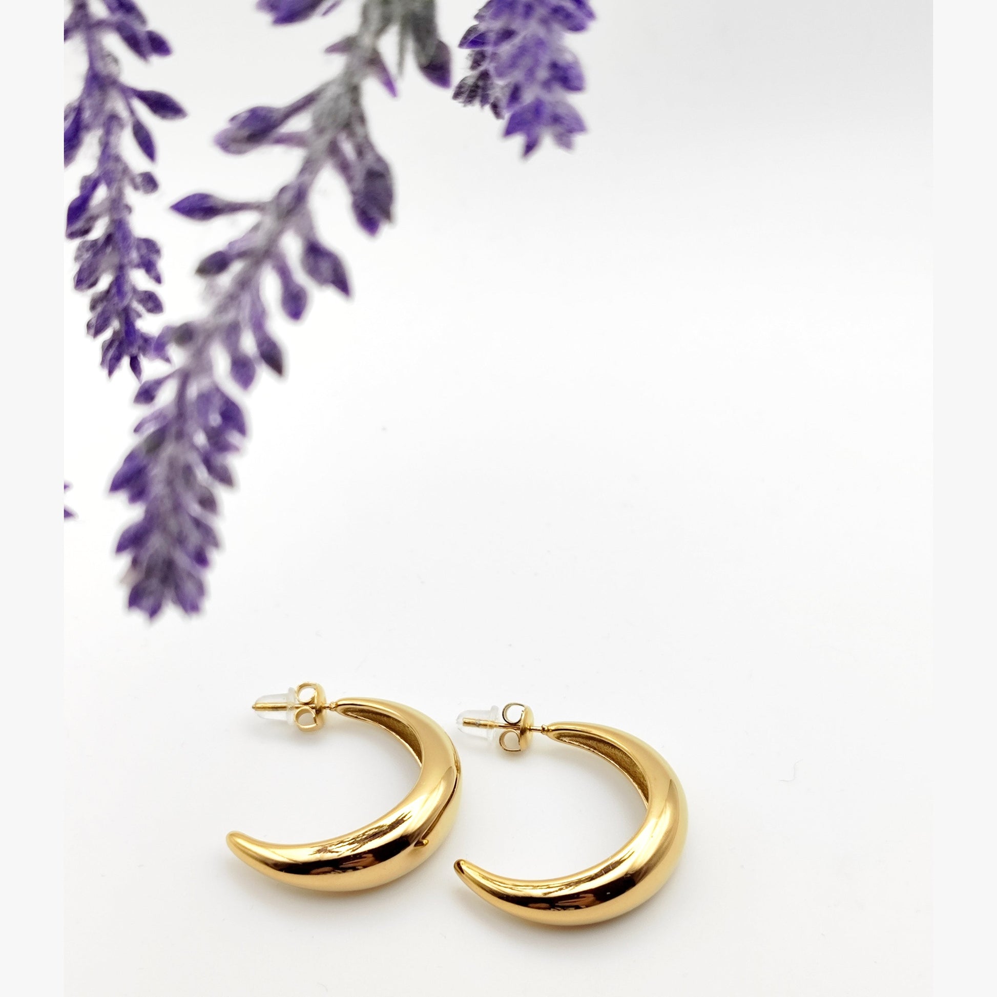 Gold and silver delicate crescent hoop earrings made of stainless steel