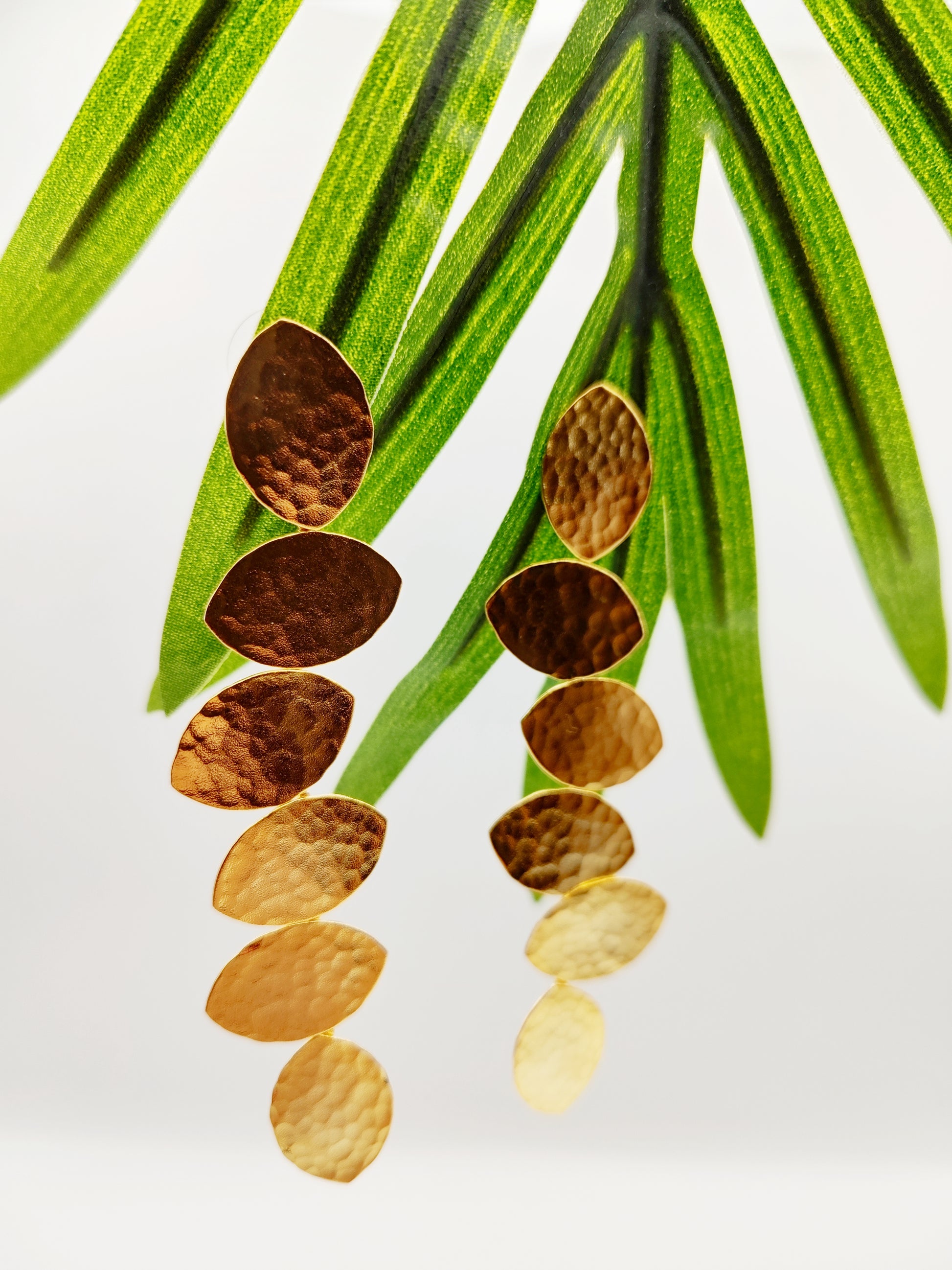 Trifyllon Earrings – Greek Hammered Jewelry – Available in 18K Gold, Silver, and Rose Gold Plated. Cascading hammered leaf design inspired by ancient Greek nature symbolism.