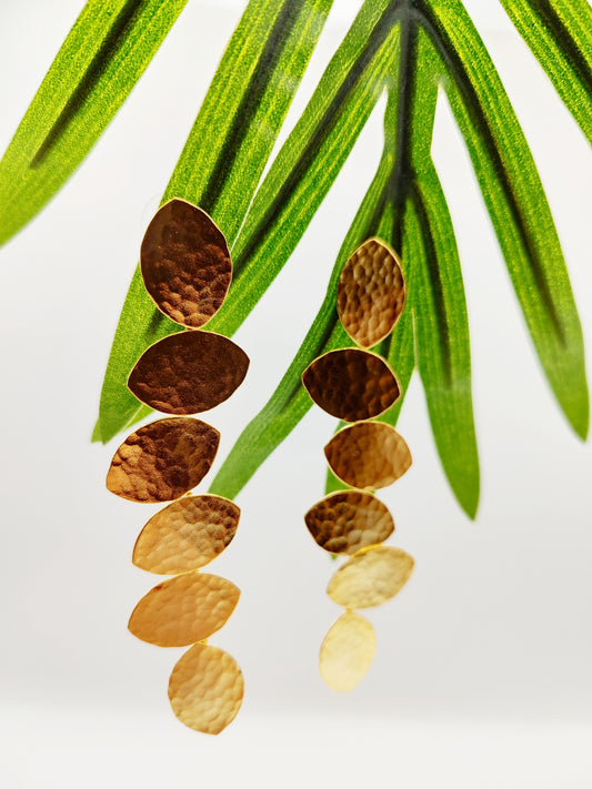 Trifyllon Earrings – Greek Hammered Jewelry – Available in 18K Gold, Silver, and Rose Gold Plated. Cascading hammered leaf design inspired by ancient Greek nature symbolism.