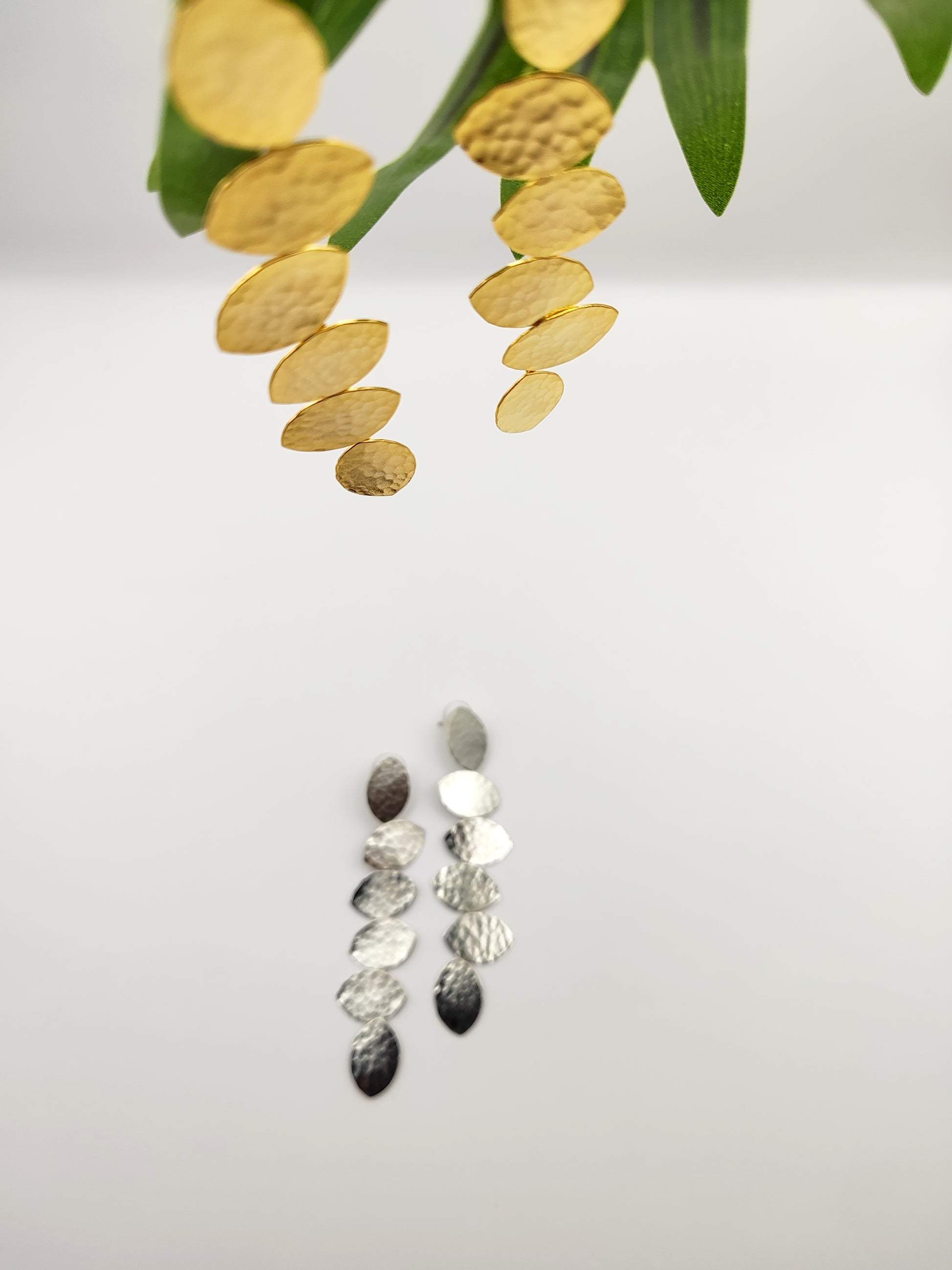 Trifyllon Earrings – Greek Hammered Jewelry – Available in 18K Gold, Silver, and Rose Gold Plated. Cascading hammered leaf design inspired by ancient Greek nature symbolism.