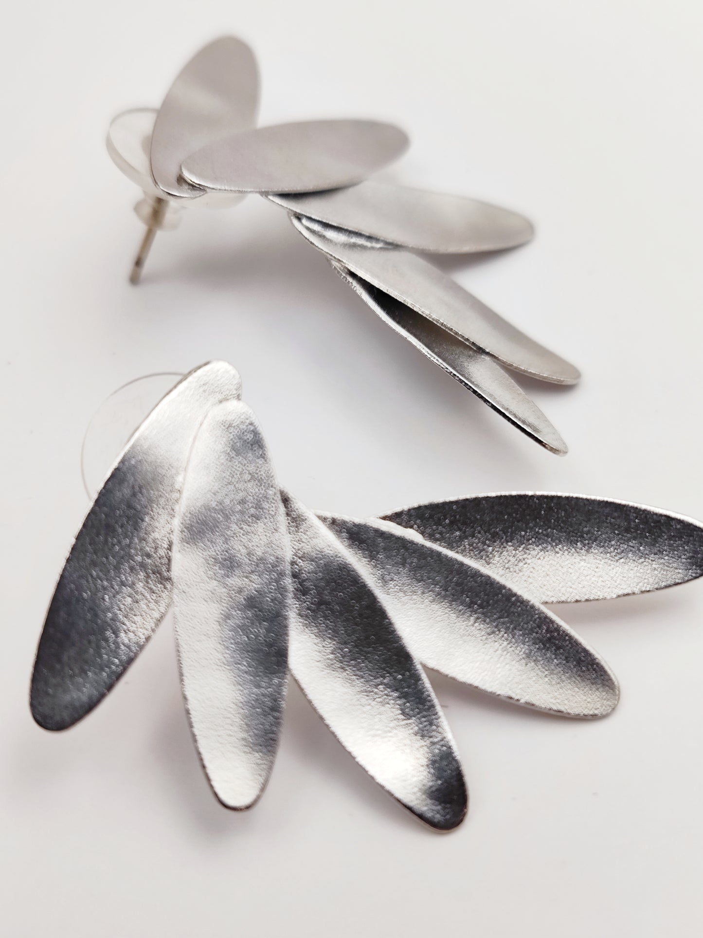 Angelos earrings – Greek hammered jewelry in 18K gold plated, 18K silver plated, and rose gold plated. Handcrafted hammered wing-inspired design.