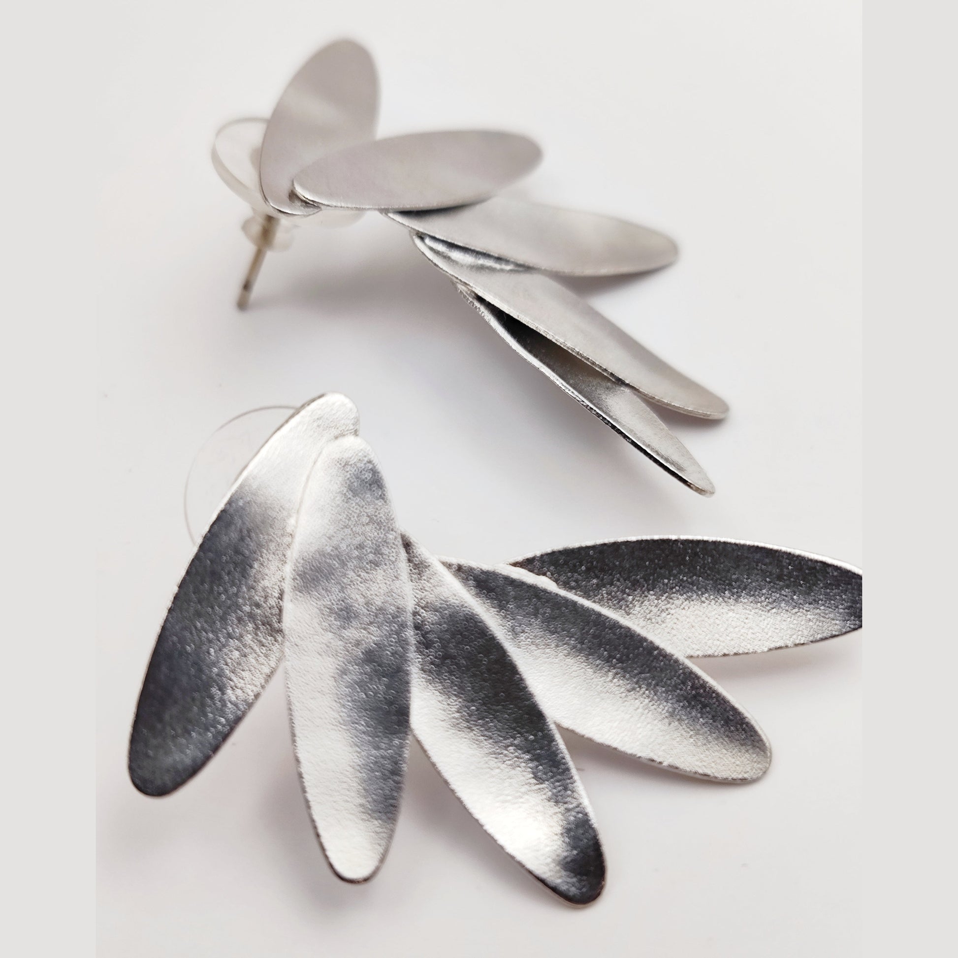 Angelos earrings – Greek hammered jewelry in 18K gold plated, 18K silver plated, and rose gold plated. Handcrafted hammered wing-inspired design.