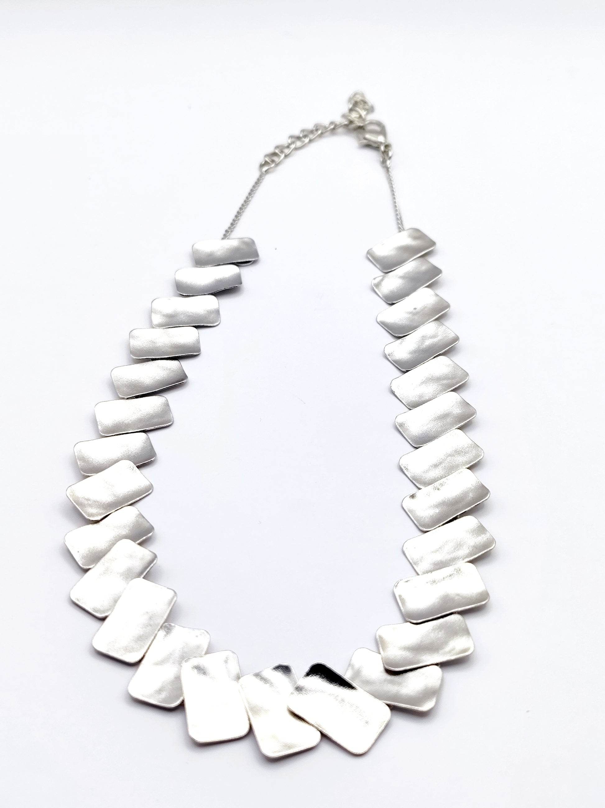 Handmade hammered necklace with rectangular gold-plated plates inspired by the poetic elegance of gold in ancient Greek culture.