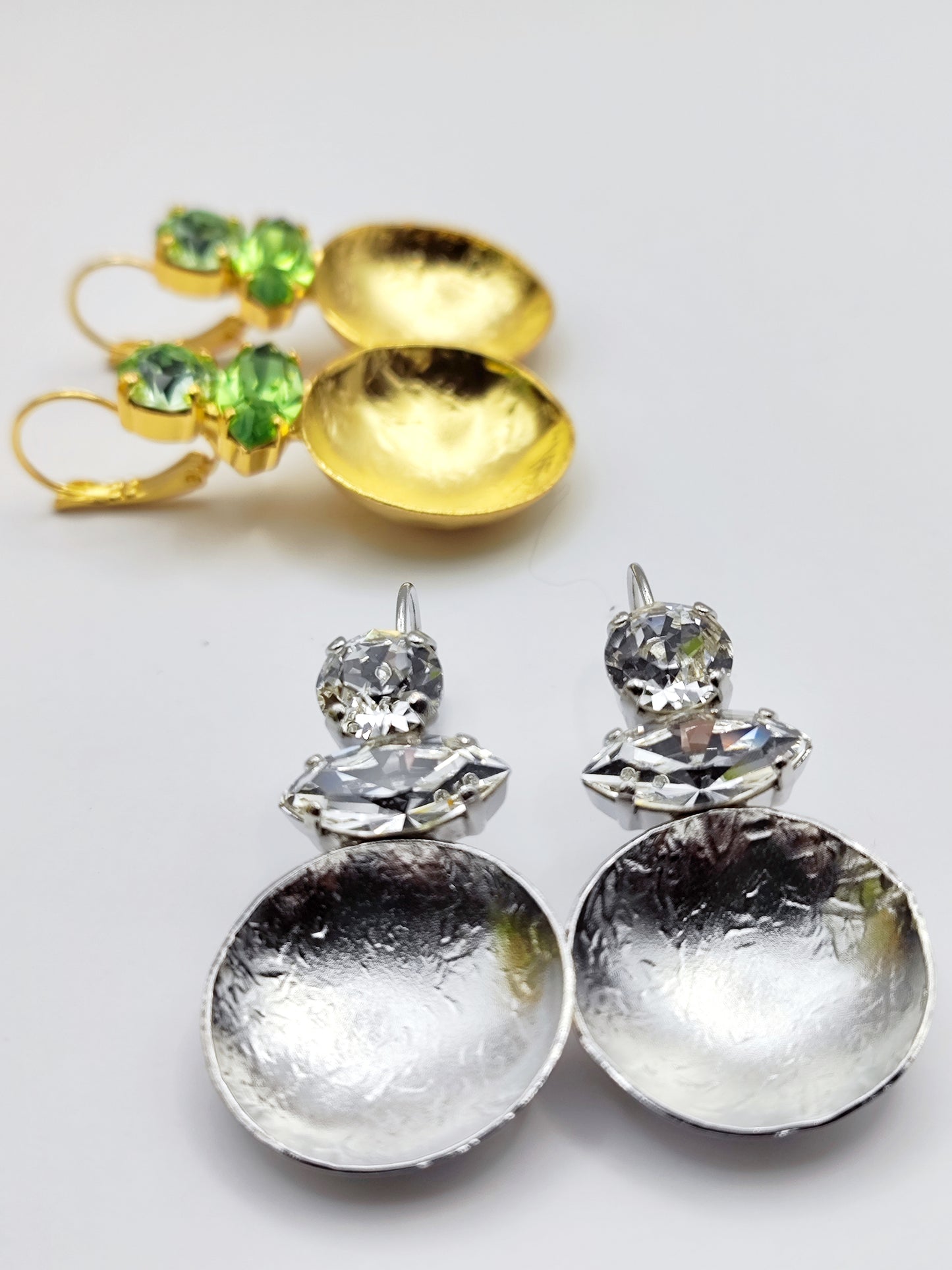 Santorini earrings with crystal – Greek hammered jewelry in 18K gold plated, 18K silver plated, and rose gold plated. Handcrafted earrings with hammered discs and sparkling crystals inspired by the island of Santorini.