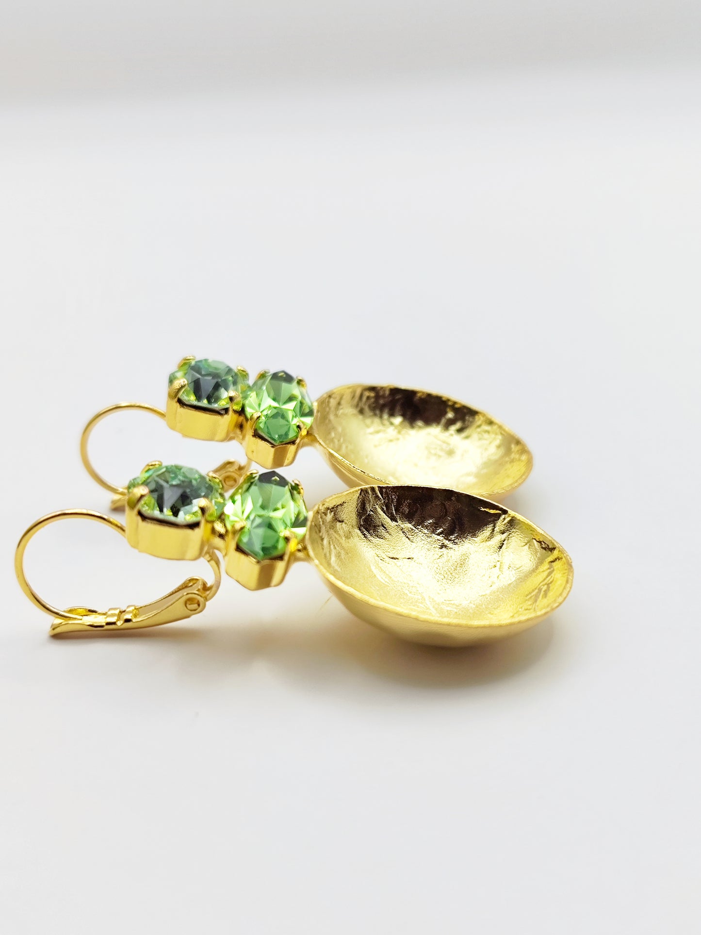 Santorini earrings with crystal – Greek hammered jewelry in 18K gold plated, 18K silver plated, and rose gold plated. Handcrafted earrings with hammered discs and sparkling crystals inspired by the island of Santorini.