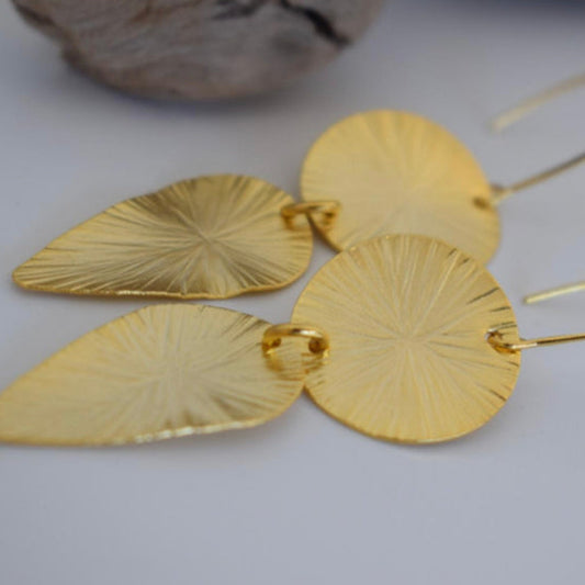 Handmade 18k gold plated earrings with sunburst disc and elongated leaf design, inspired by ancient Greek artistry