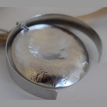 Eos Necklace – Greek Hammered Jewelry – 18K Gold, Silver, or Rose Gold Plated. Handmade circular hammered pendant with sculptural curves inspired by the goddess of dawn.