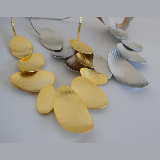 Nausicaa Necklace – Greek Hammered Jewelry – 18K Gold, Silver, or Rose Gold Plated. Statement necklace with hammered overlapping ovals inspired by sea waves.