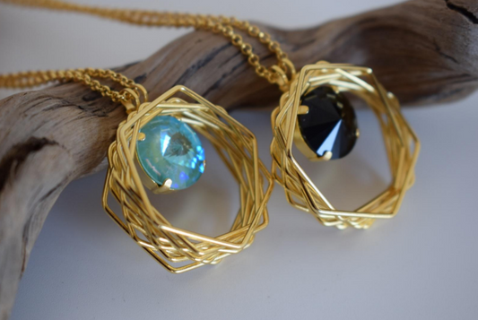Folia Necklace With Crystal – Greek Hammered Jewelry – Available in 18K Gold or Silver Plated. Circular nest-inspired design encasing Swarovski crystal.