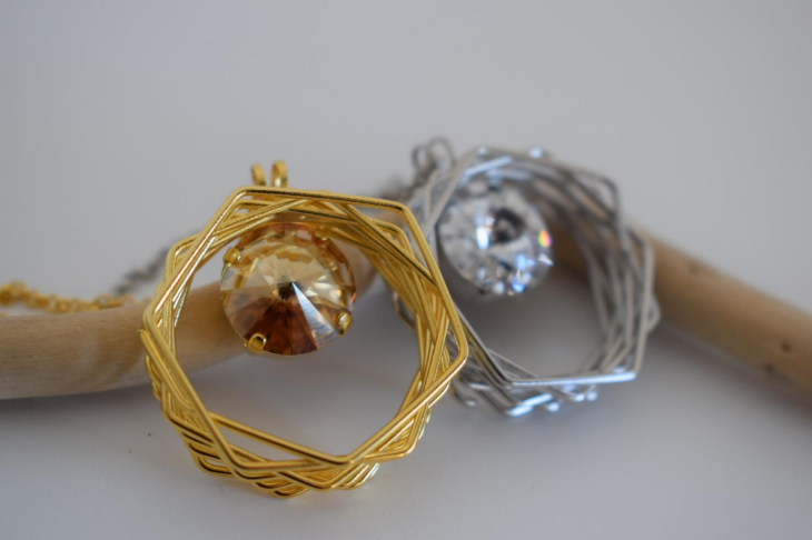 Folia Necklace With Crystal – Greek Hammered Jewelry – Available in 18K Gold or Silver Plated. Circular nest-inspired design encasing Swarovski crystal.