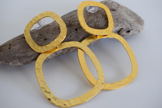 Aegis earrings in handmade Greek hammered jewelry design, available in gold plated and silver plated finishes.