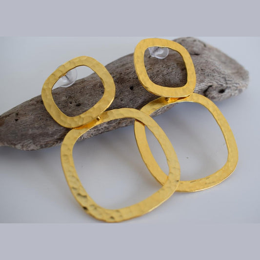 Aegis earrings in handmade Greek hammered jewelry design, available in gold plated and silver plated finishes.