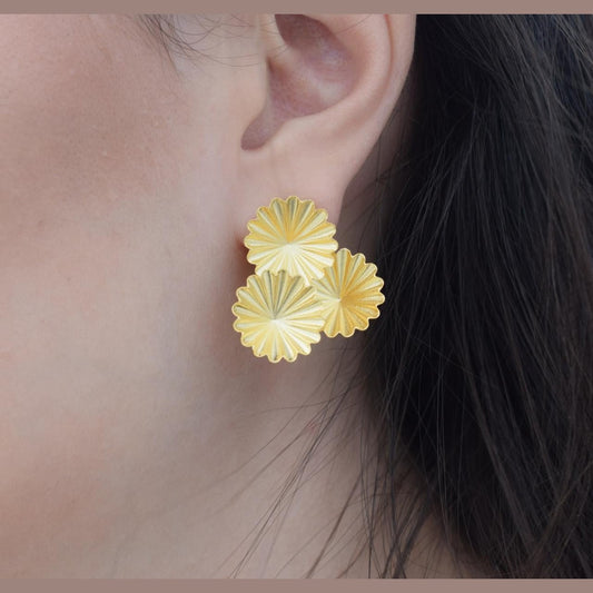 Florina earrings in Greek hammered jewelry design with floral texture, available in 18K gold plated and 18K silver plated finishes.