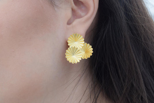 Florina earrings in Greek hammered jewelry design with floral texture, available in 18K gold plated and 18K silver plated finishes.