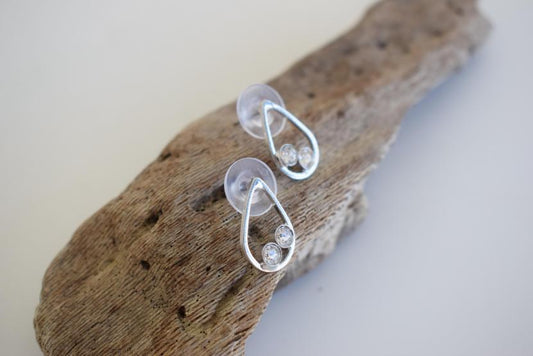 Tinos earrings in Greek hammered teardrop design with fine crystals, available in 18K gold plated and 18K silver plated finishes.