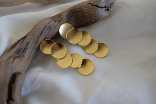 Mycenae earrings in Greek hammered circular design, available in 18K gold plated and 18K silver plated finishes.