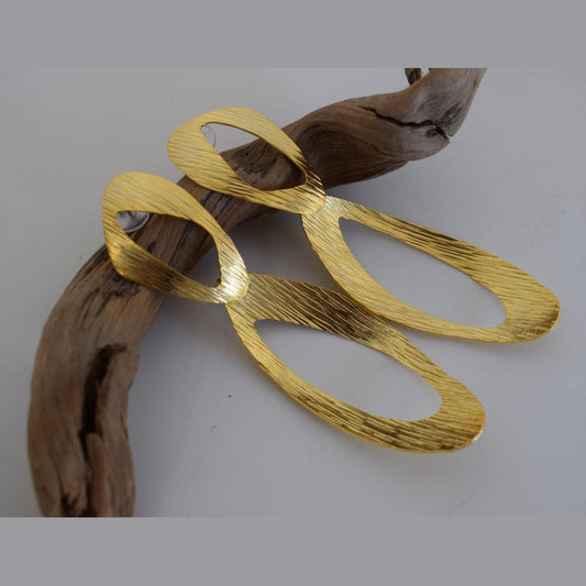 Ostraka earrings in Greek hammered open oval design, available in 18K gold plated and 18K silver plated finishes.