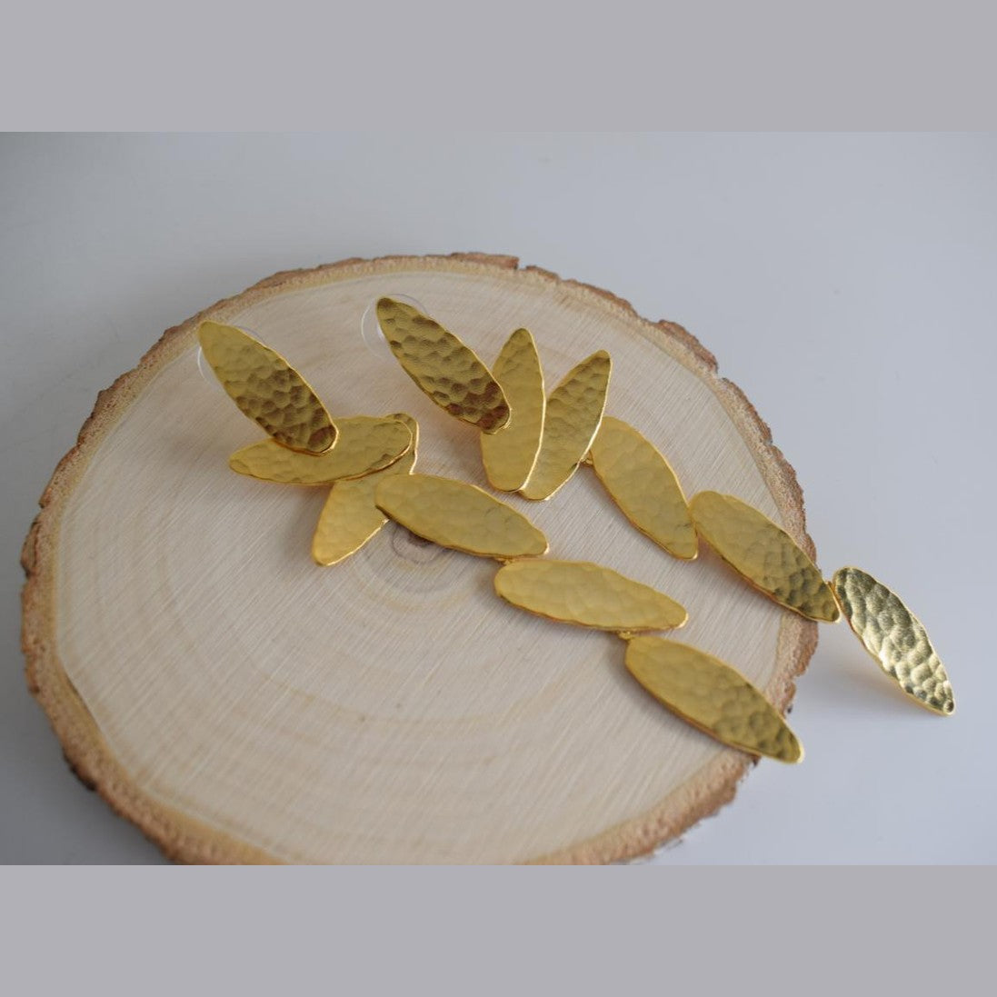 Nike2 handmade Greek hammered long drop earrings with wing-inspired forms, available in gold plated and silver plated.