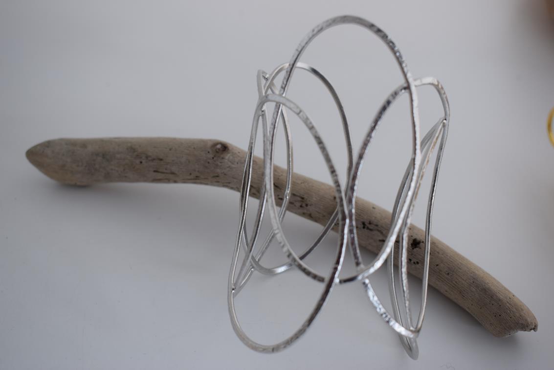 Elysia bracelet – Greek hammered jewelry with openwork interlaced design, available in 18K gold-plated, 18K silver-plated, and rose-gold plated finishes.