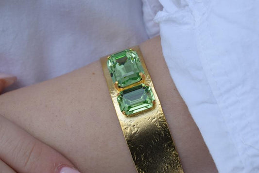 Electra bracelet – Greek hammered jewelry cuff with emerald-cut crystals, inspired by the radiant heroine Electra, available in 18K gold-plated, 18K silver-plated, and rose-gold plated finishes.