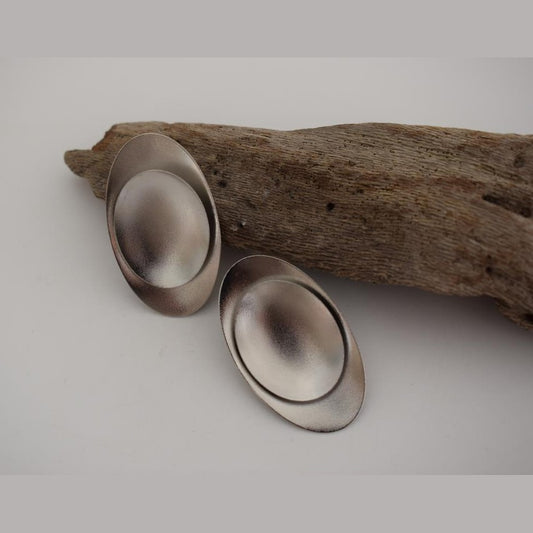 Ouranos earrings – Greek hammered jewelry with bold oval design, inspired by the god of the sky, available in 18K gold-plated, 18K silver-plated, and rose-gold plated finishes.