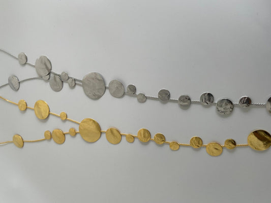 Ampelos necklace – Greek hammered jewelry with cascading hammered discs resembling grape clusters, available in 18K gold-plated, 18K silver-plated, and rose-gold plated finishes.