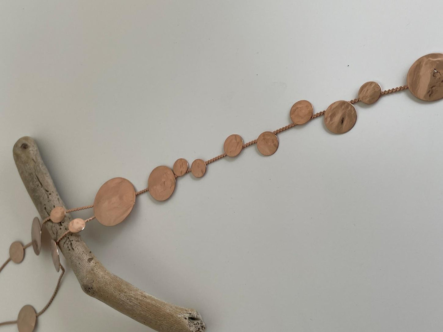 Ampelos necklace – Greek hammered jewelry with cascading hammered discs resembling grape clusters, available in 18K gold-plated, 18K silver-plated, and rose-gold plated finishes.