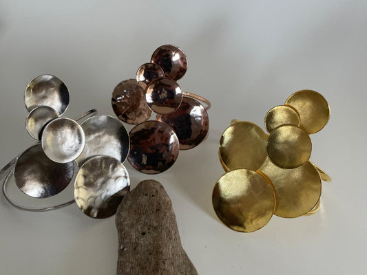 Ampelos bracelet – Greek hammered jewelry with grape motif, available in 18K gold-plated, 18K silver-plated, and rose-gold plated finishes.