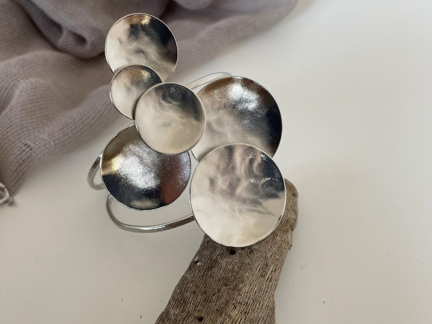 Ampelos bracelet – Greek hammered jewelry with grape motif, available in 18K gold-plated, 18K silver-plated, and rose-gold plated finishes.