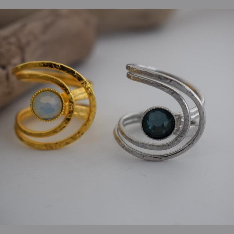 Orion ring Greek hammered jewelry spiral design with round-cut crystal in 18K gold, silver, and rose gold plated finish.