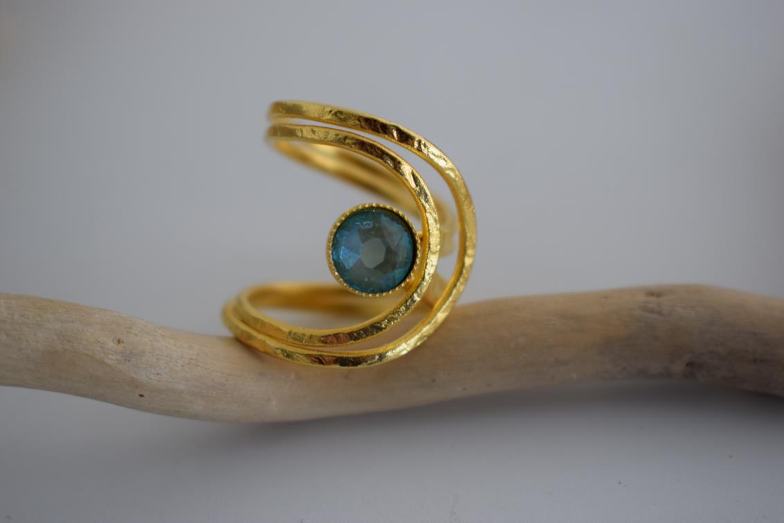 Orion ring Greek hammered jewelry spiral design with round-cut crystal in 18K gold, silver, and rose gold plated finish.