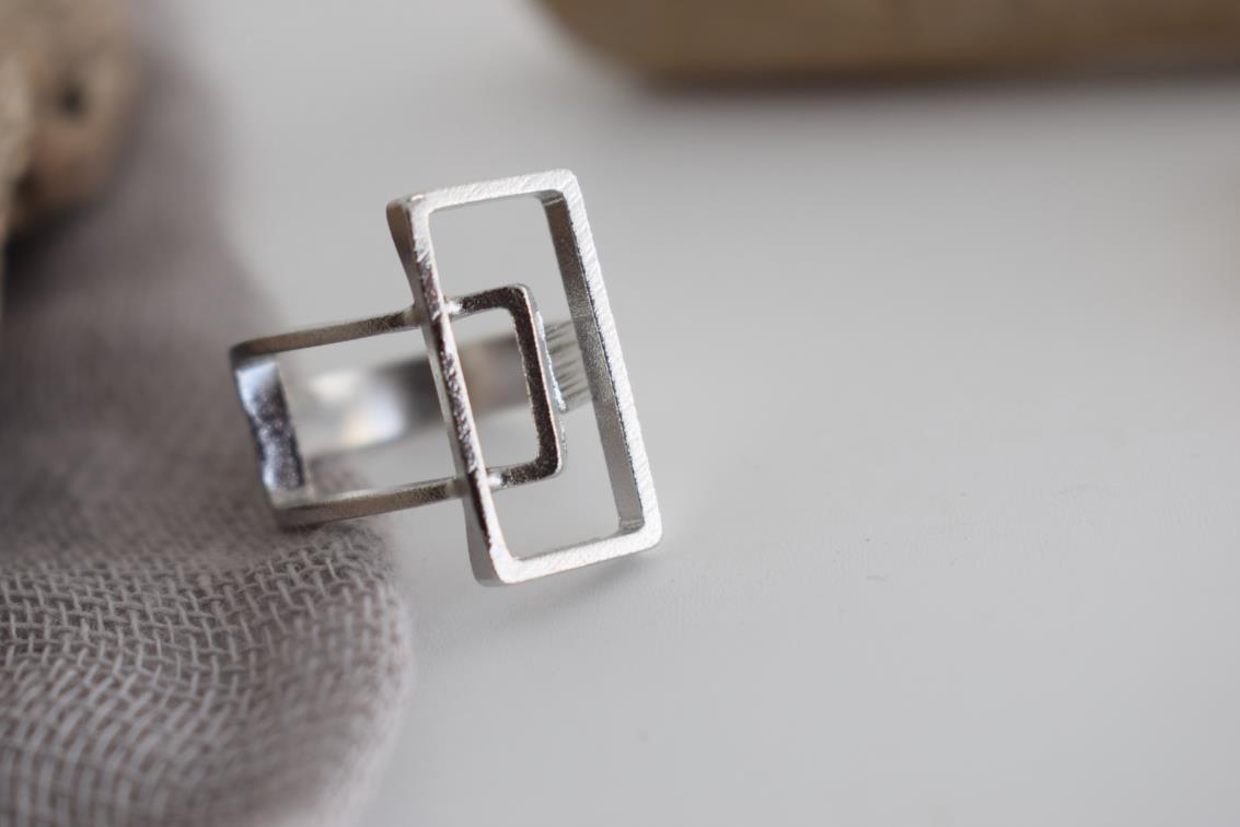 Geometria ring Greek hammered jewelry with rectangular openwork design, available in gold, silver, and rose gold plated.