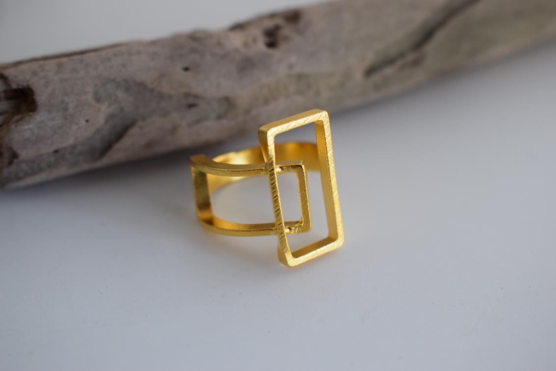 Geometria ring Greek hammered jewelry with rectangular openwork design, available in gold, silver, and rose gold plated.