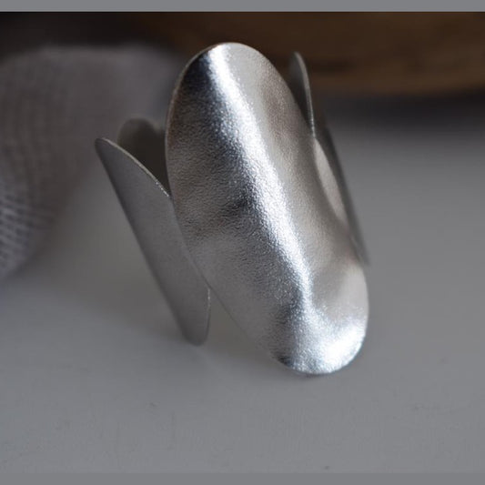 Delos ring Greek hammered jewelry with oval double-disc design, available in gold, silver, and rose gold plated.