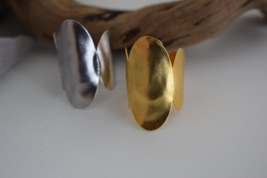 Delos ring Greek hammered jewelry with oval double-disc design, available in gold, silver, and rose gold plated.