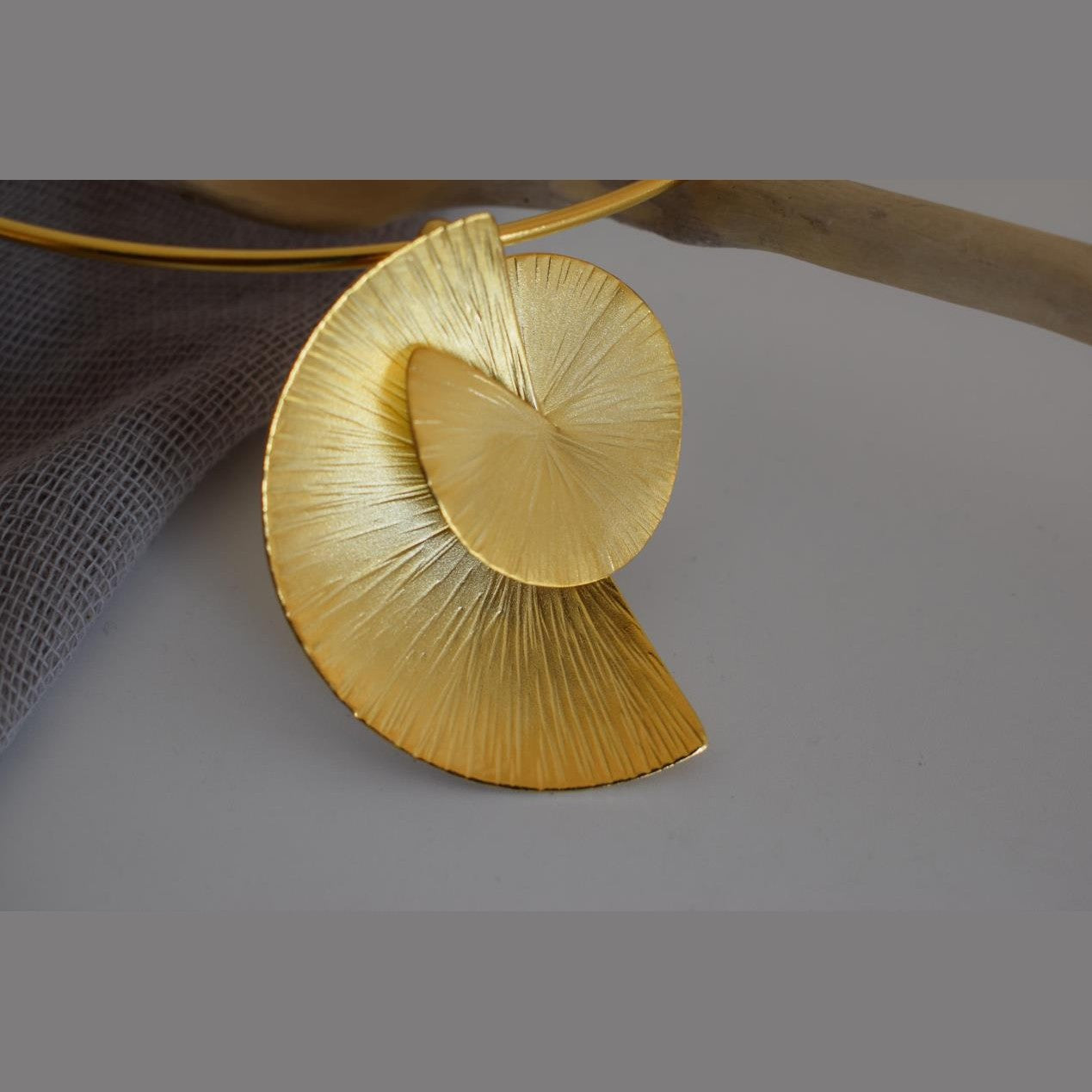 Kochlias necklace Greek hammered jewelry spiral seashell design in 18K gold, silver, and rose gold plated finish.