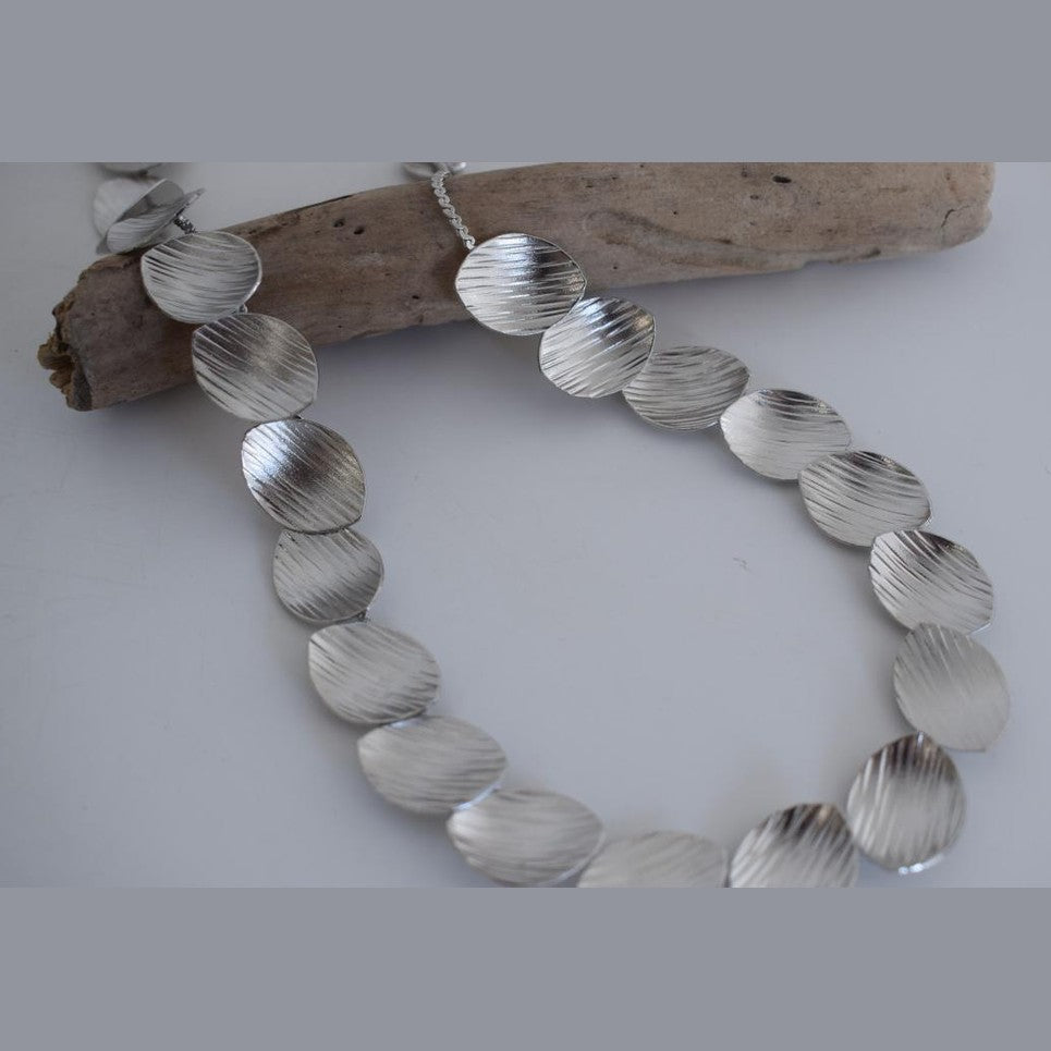 Nausicaa Necklace – Handmade Greek hammered jewelry with leaf design, available in 18K gold or silver plated finish.