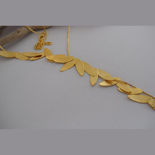 Nike Necklace – Handmade Greek hammered jewelry with golden leaf design, inspired by the goddess of victory, available in 18K gold or silver plated.