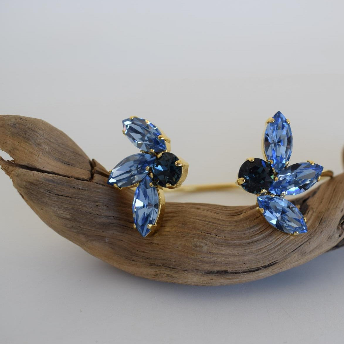 Amaryllis Bracelet – handmade Greek hammered jewelry with blue Swarovski crystals, available in 18K gold or silver plated.