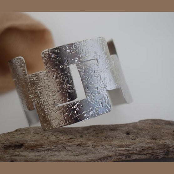 Labyrinthos Bracelet – handmade Greek hammered jewelry inspired by the ancient Labyrinth of Crete, available in 18K gold or silver plated.