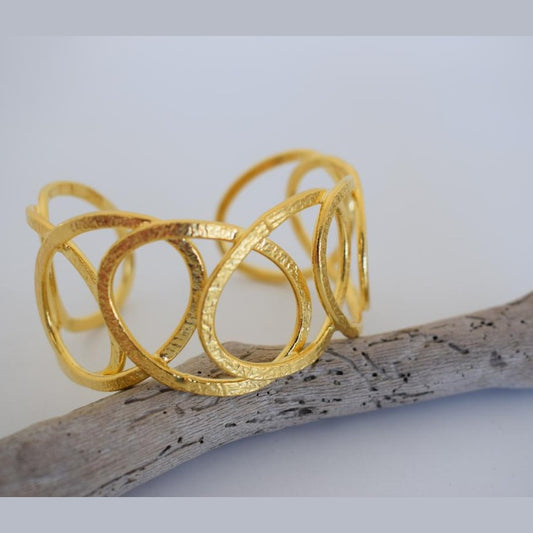 Handmade Hydor bracelet, Greek hammered jewelry in 18K gold or silver plated with flowing openwork sculptural design.