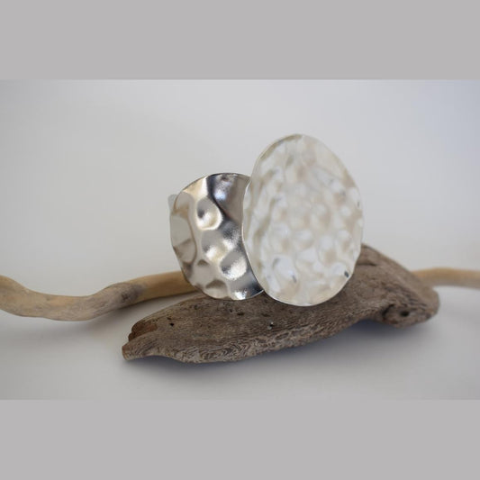 Echo bracelet, handmade Greek hammered jewelry with sculptural circular design, available in 18K gold or silver plated.