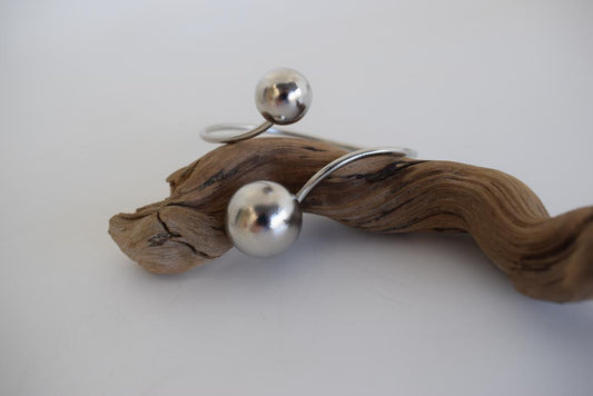 Handmade Sphaira bracelet, Greek hammered jewelry in 18K gold or silver plated with two sculptural spherical elements.