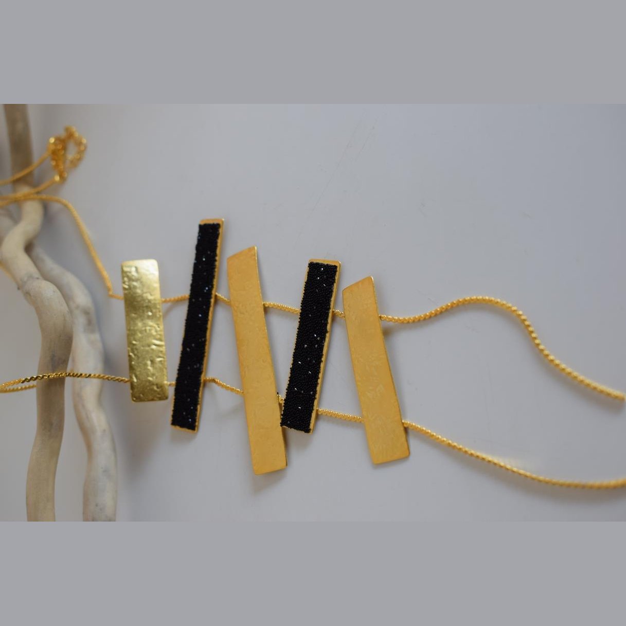 Ravdos necklace – Greek hammered jewelry available in 18K gold plated, 18K silver plated, and rose gold plated versions, adorned with striking black crystal inlays.