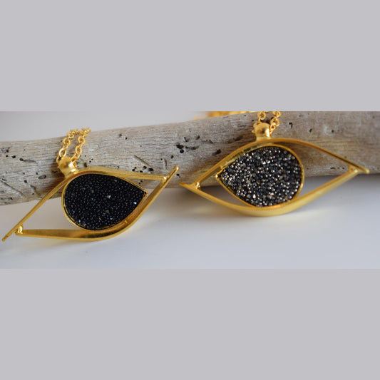Eye necklace with hammered eye design and stones. Greek hammered jewelry in 18K gold, silver